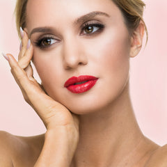 Model wearing red shimmer natural lipstick 