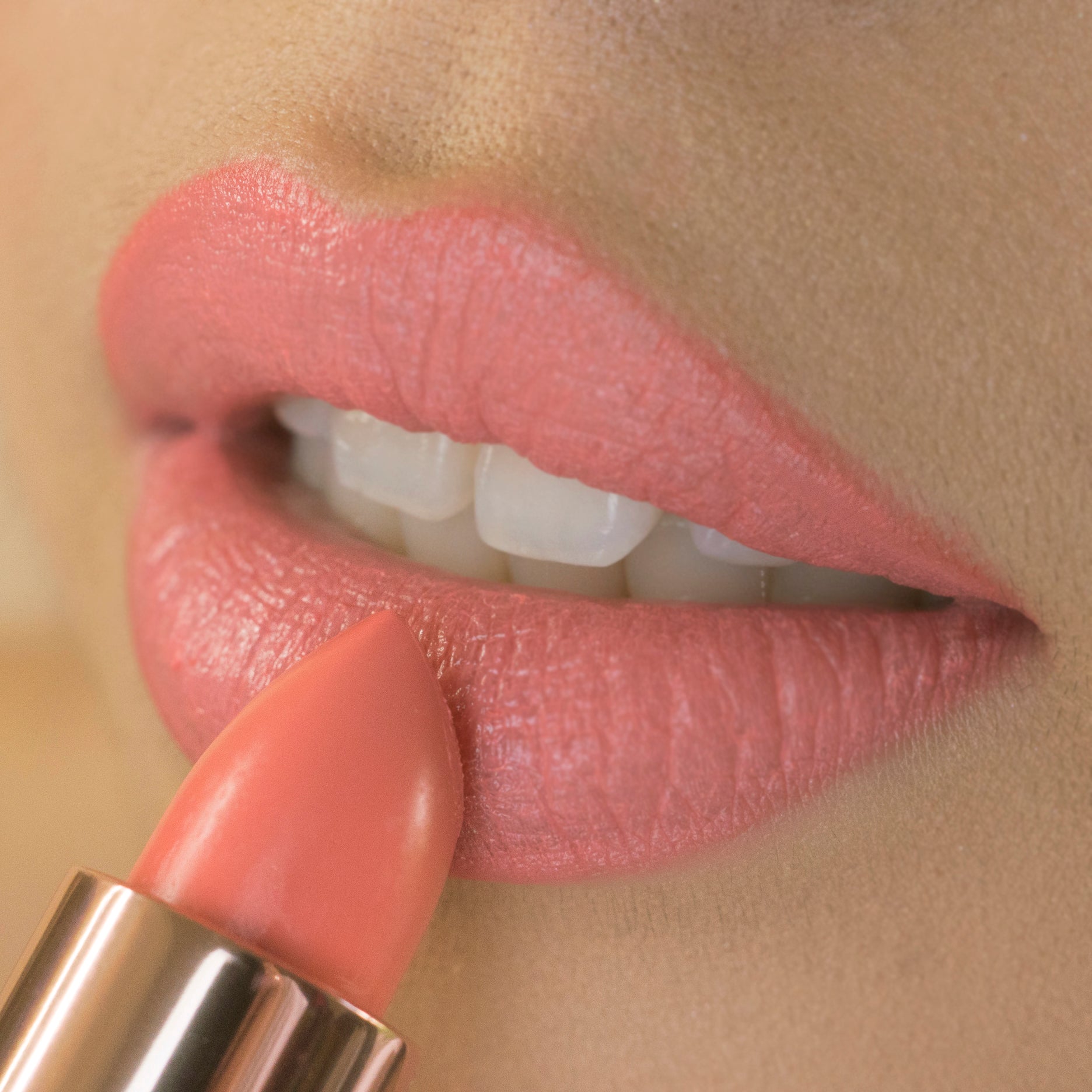 Peach lipstick on lips 
