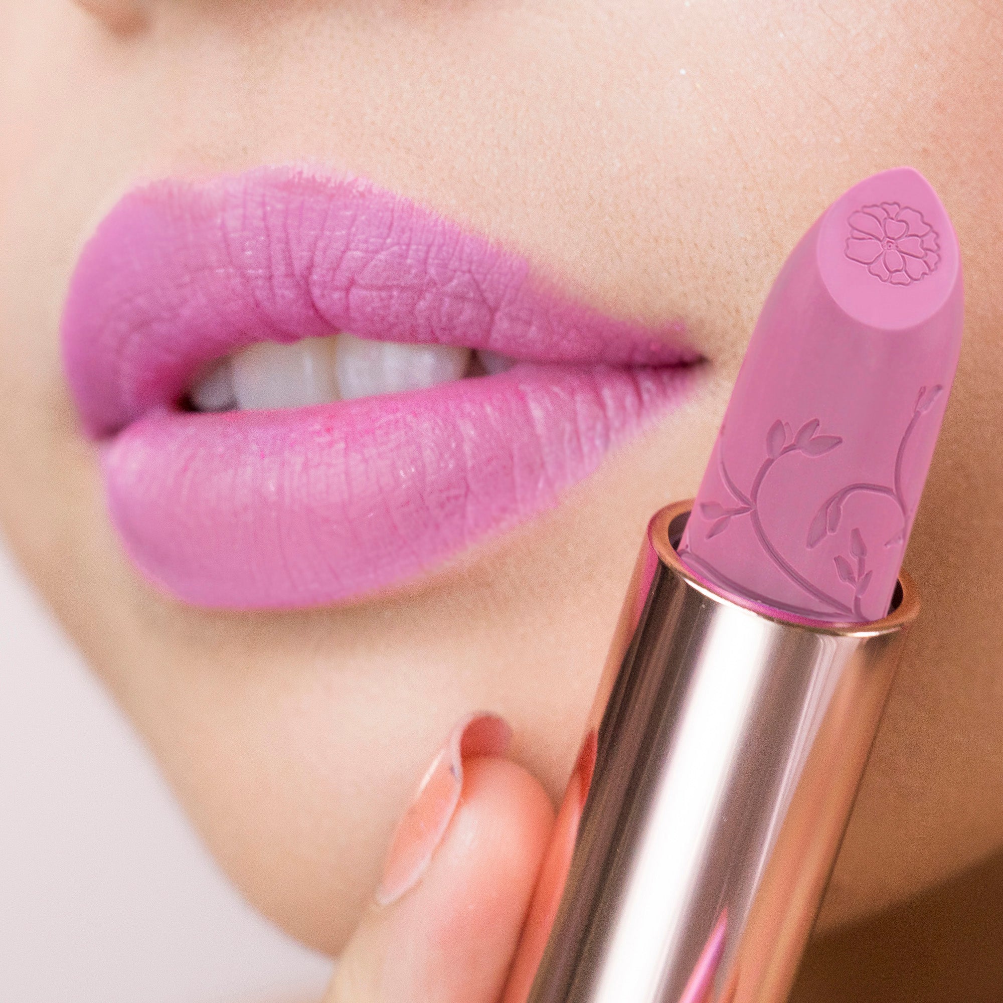 Model wearing lilac lipstick on her lips 